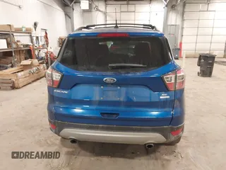 2017 Ford Escape SE z VIN 1FMCU0G90HUA94581, wystawiony jako IAAI lot #41396965 z przebiegiem 104 978 mil mil oraz . Historia ofert i sprzedaży dostępna na DreamBid. Obrazek 16.