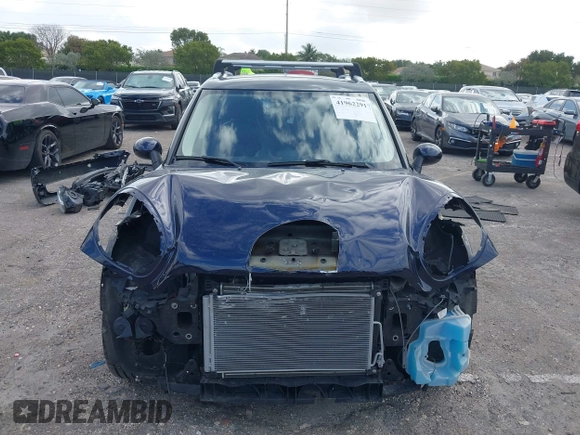 2013 MINI Countryman with VIN WMWZB3C58DWM07817, listed as a IAAI auction lot 41962291 with 60,763 mi miles and . Bid and sale history available at DreamBid. Image 13.