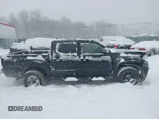 2018 Toyota Tacoma SR with VIN 3TMCZ5AN6JM182800, listed as a IAAI auction lot 41524950 with 63,838 mi miles and . Bid and sale history available at DreamBid. Image 14.