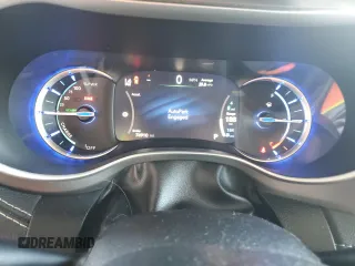 2021 Chrysler Pacifica Hybrid Touring L with VIN 2C4RC1L7XMR593911, listed as a Copart auction lot 57842415 with 74,910 mi miles and Salvage title. Bid and sale history available at DreamBid. Image 9.