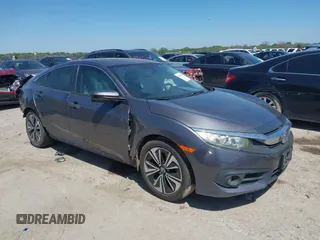 2016 Honda Civic EX-L z VIN 2HGFC1F77GH640323, wystawiony jako IAAI lot #41969858 z przebiegiem Nie podano mil oraz . Historia ofert i sprzedaży dostępna na DreamBid. Obrazek 1.