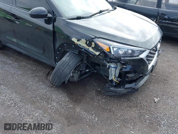 2019 Hyundai Tucson SE with VIN KM8J2CA46KU977863, listed as a IAAI auction lot 41704318 with 23,076 mi miles. Bid and sale history available at carsss.com. Image 6.