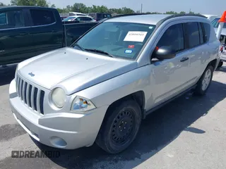 2008 Jeep Compass Sport with VIN 1J8FT47048D767281, listed as a IAAI auction lot 42010343 with 164,734 mi miles. Bid and sale history available at carsss.com. Image 2.