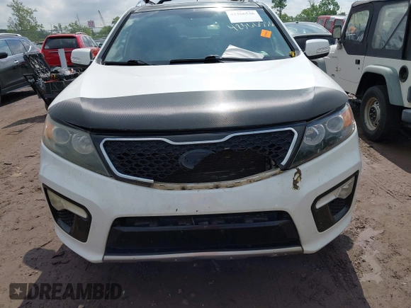 2012 Kia Sorento SX z VIN 5XYKWDA23CG231228, wystawiony jako IAAI lot #42366536 z przebiegiem 154 627 mil mil oraz . Historia ofert i sprzedaży dostępna na DreamBid. Obrazek 12.