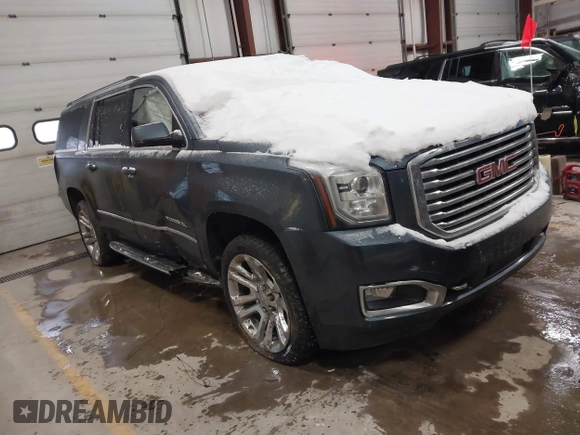 2019 GMC Yukon XL SLT with VIN 1GKS2GKC5KR137005, listed as a IAAI auction lot 41435370 with 125,453 mi miles and . Bid and sale history available at carsss.com. Image 1.