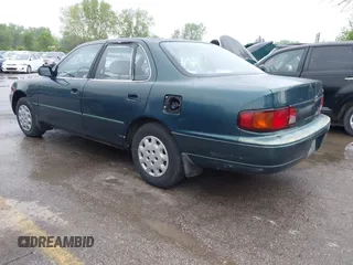 1996 Toyota Camry DX with VIN JT2BG12K5T0346311, listed as a IAAI auction lot 42130482 with 214,872 mi miles. Bid and sale history available at carsss.com. Image 3.