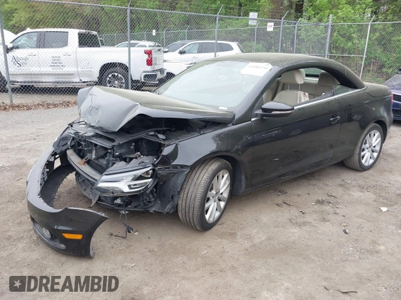 2014 Volkswagen Eos Komfort with VIN WVWBW8AH2EV001719, listed as a IAAI auction lot 42080290 with 105,661 mi miles and . Bid and sale history available at DreamBid. Image 2.