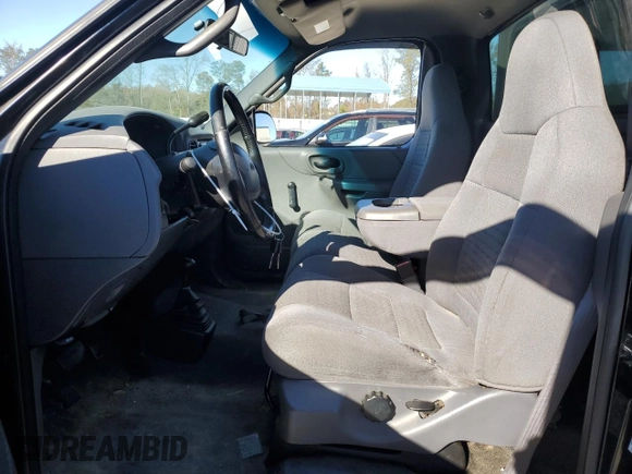 2002 Ford F-150 XL with VIN 1FTRF18232NA58109, listed as a Copart auction lot 79080674 with 148,213 mi miles and Salvage title. Bid and sale history available at DreamBid. Image 7.