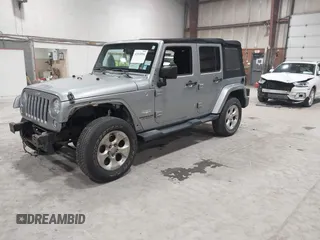 2014 Jeep Wrangler Unlimited Sahara with VIN 1C4BJWEG5EL164350, listed as a IAAI auction lot 42018586 with 113,222 mi miles. Bid and sale history available at carsss.com. Image 2.