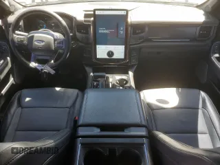 2023 Ford F-150 Lightning Pro with VIN 1FTVW1EV1PWG17333, listed as a Copart auction lot 57904025 with 21,173 mi miles and Salvage title. Bid and sale history available at DreamBid. Image 8.