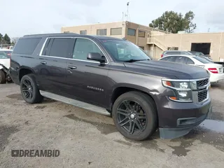 2015 Chevrolet Suburban LT z VIN 1GNSKJKC7FR251173, wystawiony jako IAAI lot #41593991 z przebiegiem 192 699 mil mil oraz . Historia ofert i sprzedaży dostępna na DreamBid. Obrazek 1.