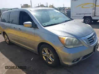 2010 Honda Odyssey Touring with VIN 5FNRL3H90AB038351, listed as a IAAI auction lot 42036500 with 176,304 mi miles. Bid and sale history available at carsss.com. Image 1.