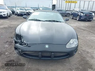 1997 Jaguar XK with VIN SAJGX274XVC017622, listed as a IAAI auction lot 41614339 with 94,298 mi miles and . Bid and sale history available at DreamBid. Image 11.