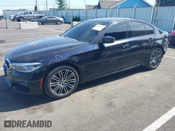 2018 BMW 5 Series 530e xDrive with VIN WBAJB1C51JB374308, listed as a IAAI auction lot 41965038 with 122,791 mi miles and . Bid and sale history available at carsss.com. Image 2.