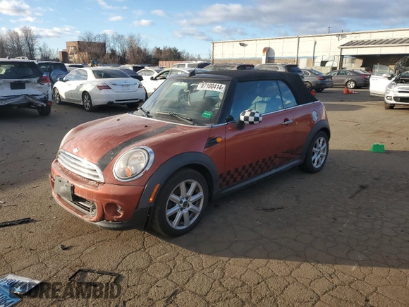 2012 MINI Convertible z VIN WMWZN3C57CT265368, wystawiony jako Copart lot #87100414 z przebiegiem 124 102 mil mil oraz Szkoda całkowita • Salvage title. Historia ofert i sprzedaży dostępna na DreamBid. Obrazek 1.