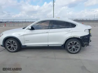 2015 BMW X4 xDrive28i with VIN 5UXXW3C53F0M88714, listed as a IAAI auction lot 41483692 with 132,054 mi miles. Bid and sale history available at carsss.com. Image 14.