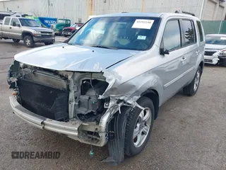 2013 Honda Pilot EX-L with VIN 5FNYF3H76DB013332, listed as a IAAI auction lot 41193240 with 121,308 mi miles and . Bid and sale history available at DreamBid. Image 2.
