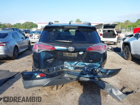 2018 Toyota RAV4 LE with VIN JTMZFREV1JJ203943, listed as a IAAI auction lot 41921863 with 104,691 mi miles. Bid and sale history available at carsss.com. Image 16.