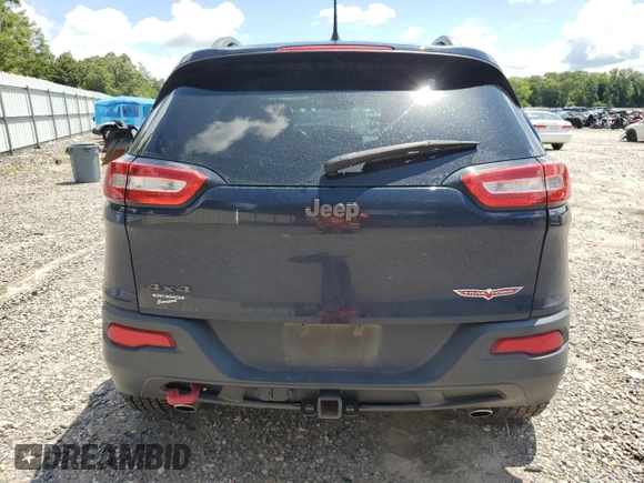 2014 Jeep Cherokee Trailhawk with VIN 1C4PJMBS7EW170345, listed as a Copart auction lot 60565765 with 98,382 mi miles and Salvage title. Bid and sale history available at DreamBid. Image 6.