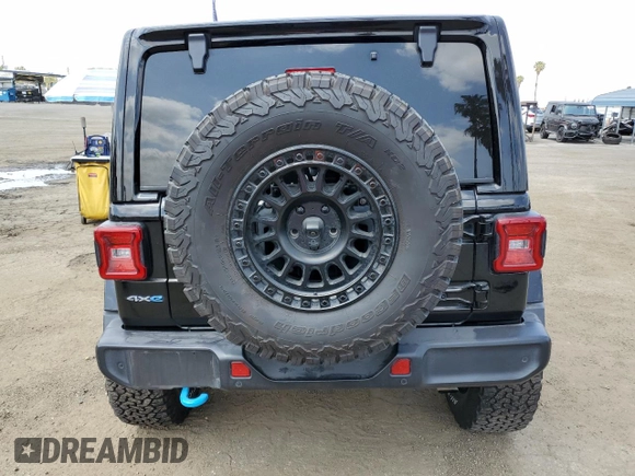 2024 Jeep Wrangler Sahara with VIN 1C4RJXP60RW116607, listed as a Copart auction lot 54562695 with 62,352 mi miles and Salvage title. Bid and sale history available at DreamBid. Image 6.