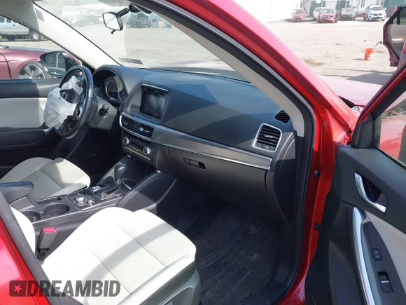 2016 Mazda CX-5 Grand Touring with VIN JM3KE4DY9G0850583, listed as a IAAI auction lot 42075545 with 92,789 mi miles and . Bid and sale history available at carsss.com. Image 5.