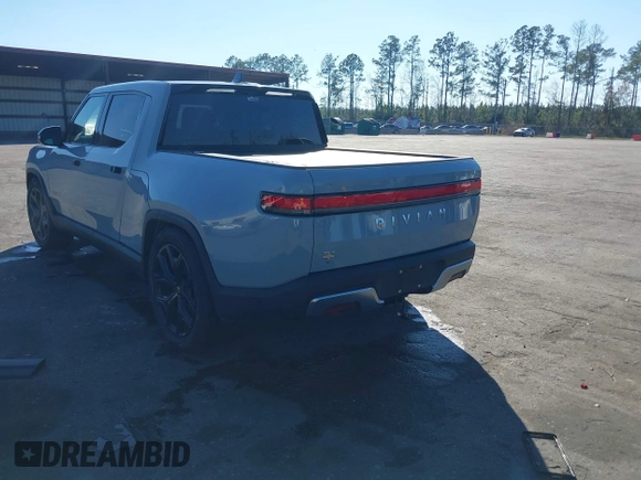 2024 Rivian R1T Adventure z VIN 7FCTGAAA5RN033799, wystawiony jako IAAI lot #41606562 z przebiegiem 9 449 mil mil oraz . Historia ofert i sprzedaży dostępna na DreamBid. Obrazek 3.