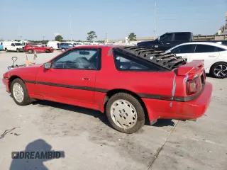 1988 Toyota Supra z VIN JT2MA71JXJ0094266, wystawiony jako Copart lot #59028715 z przebiegiem 133 654 mil mil oraz Czysty tytuł • Clean title. Historia ofert i sprzedaży dostępna na DreamBid. Obrazek 2.
