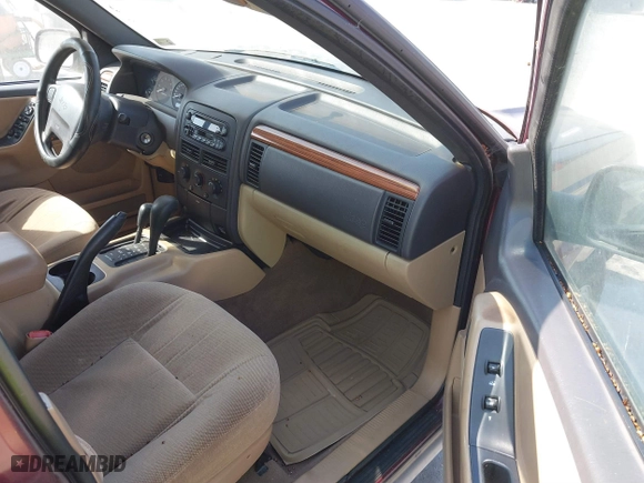 1999 Jeep Grand Cherokee Laredo with VIN 1J4GW58S6XC554582, listed as a IAAI auction lot 41780284 with 183,156 mi miles. Bid and sale history available at carsss.com. Image 5.