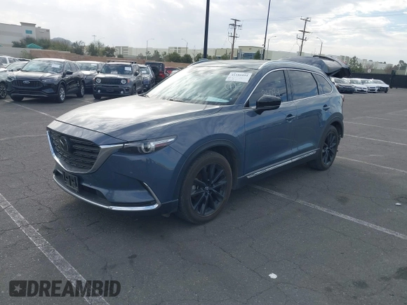 2021 Mazda CX-9 Grand Touring with VIN JM3TCADY1M0519288, listed as a IAAI auction lot 41186094 with 50,701 mi miles and . Bid and sale history available at DreamBid. Image 2.