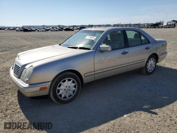 1999 Mercedes-Benz E-Class with VIN WDBJF65H5XA804902, listed as a Copart auction lot 73704634 with 92,411 mi miles and Salvage Title. Bid and sale history available at carsss.com. Image 1.
