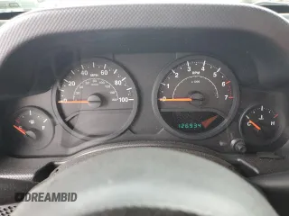 2009 Jeep Wrangler X z VIN 1J4FA24169L706787, wystawiony jako Copart lot #51540265 z przebiegiem 126 934 mil mil oraz Szkoda całkowita • Salvage title. Historia ofert i sprzedaży dostępna na DreamBid. Obrazek 9.