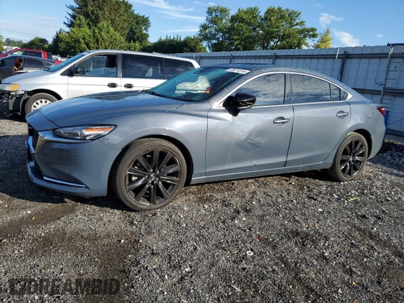 2021 Mazda 6 Grand Touring Reserve with VIN JM1GL1WY3M1602898, listed as a Copart auction lot 67871314 with 104,679 mi miles and Salvage Title. Bid and sale history available at DreamBid. Image 1.