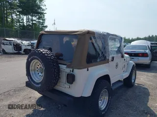 2002 Jeep Wrangler Sahara with VIN 1J4FA59S92P734763, listed as a IAAI auction lot 42411004 with 188,213 mi miles and . Bid and sale history available at DreamBid. Image 4.