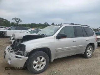 2005 GMC Envoy SLT with VIN 1GKDT13S852330514, listed as a Copart auction lot 71190504 with 203,616 mi miles and Salvage Title. Bid and sale history available at carsss.com. Image 1.