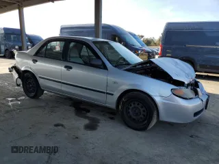 2002 Mazda Protege DX with VIN JM1BJ225120605237, listed as a Copart auction lot 49331225 with 184,556 mi miles and Salvage Title. Bid and sale history available at DreamBid. Image 4.
