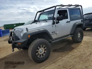 2009 Jeep Wrangler X с VIN 1J4FA24199L787574, выставлен на аукционе Copart как лот 58189835 с пробегом 74 331 миль миль и Списание • Salvage title. История ставок и продаж доступна на DreamBid. Изображение 1.