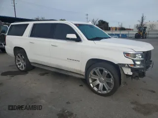 2015 Chevrolet Suburban LT with VIN 1GNSCJKC2FR601516, listed as a Copart auction lot 48480595 with 176,875 mi miles and Salvage title. Bid and sale history available at DreamBid. Image 4.