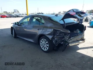 2019 Toyota Camry LE with VIN 4T1B11HK8KU204599, listed as a IAAI auction lot 42096889 with 76,518 mi miles and . Bid and sale history available at DreamBid. Image 3.