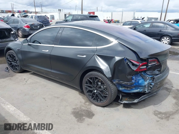 2018 Tesla Model 3 Long Range Battery with VIN 5YJ3E1EA7JF012249, listed as a IAAI auction lot 41782972 with 103,412 mi miles. Bid and sale history available at carsss.com. Image 3.