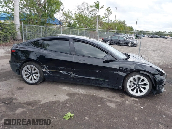 2023 Tesla Model 3 z VIN 5YJ3E1EA4PF433466, wystawiony jako IAAI lot #42249247 z przebiegiem 39 808 mil mil oraz . Historia ofert i sprzedaży dostępna na DreamBid. Obrazek 14.