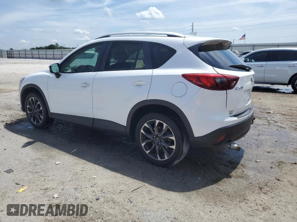 2016 Mazda CX-5 Grand Touring z VIN JM3KE2DYXG0731462, wystawiony jako Copart lot #58220465 z przebiegiem 130 033 mil mil oraz Szkoda całkowita • Salvage title. Historia ofert i sprzedaży dostępna na DreamBid. Obrazek 2.
