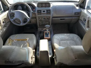 1998 Mitsubishi Montero z VIN JA4MR51R0WJ000921, wystawiony jako Copart lot #56250965 z przebiegiem 181 293 mil mil oraz Szkoda całkowita • Salvage title. Historia ofert i sprzedaży dostępna na DreamBid. Obrazek 8.