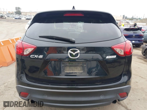 2014 Mazda CX-5 Touring z VIN JM3KE2CY3E0355332, wystawiony jako IAAI lot #42096306 z przebiegiem 108 198 mil mil oraz . Historia ofert i sprzedaży dostępna na DreamBid. Obrazek 15.