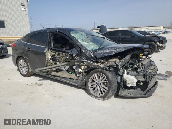 2016 Ford Focus Titanium with VIN 1FADP3J20GL274263, listed as a Copart auction lot 48340175 with 114,941 mi miles and Salvage title. Bid and sale history available at DreamBid. Image 4.