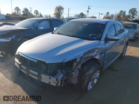 2014 Ford Taurus SEL z VIN 1FAHP2E87EG121069, wystawiony jako IAAI lot #41030422 z przebiegiem 138 043 mil mil oraz . Historia ofert i sprzedaży dostępna na DreamBid. Obrazek 6.
