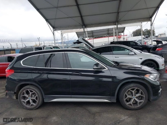 2019 BMW X1 sDrive28i with VIN WBXHU7C54K3H45266, listed as a IAAI auction lot 41572498 with 81,303 mi miles. Bid and sale history available at carsss.com. Image 13.