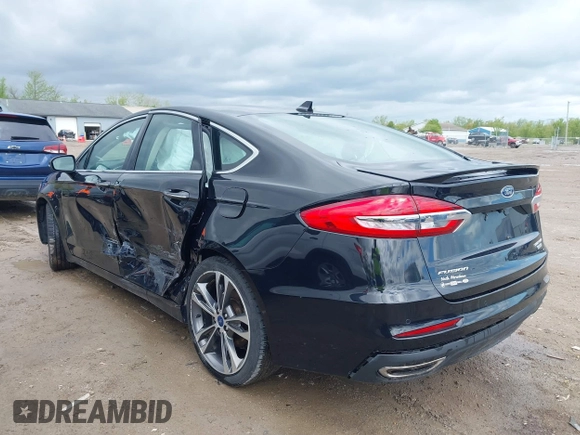 2019 Ford Fusion Titanium with VIN 3FA6P0K92KR248521, listed as a IAAI auction lot 42198307 with 51,844 mi miles and . Bid and sale history available at DreamBid. Image 3.