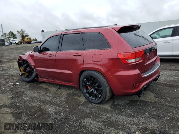 2012 Jeep Grand Cherokee SRT8 with VIN 1C4RJFDJ0CC351195, listed as a Copart auction lot 72794454 with 104,672 mi miles and Salvage Title. Bid and sale history available at carsss.com. Image 2.