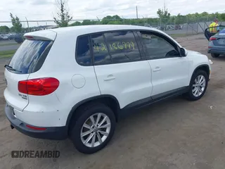 2014 Volkswagen Tiguan S with VIN WVGBV3AX0EW589381, listed as a IAAI auction lot 42186999 with 144,137 mi miles and . Bid and sale history available at DreamBid. Image 4.