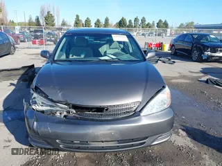 2004 Toyota Camry LE with VIN 4T1BF30K94U577260, listed as a IAAI auction lot 41906287 with 68,499 mi miles. Bid and sale history available at carsss.com. Image 13.
